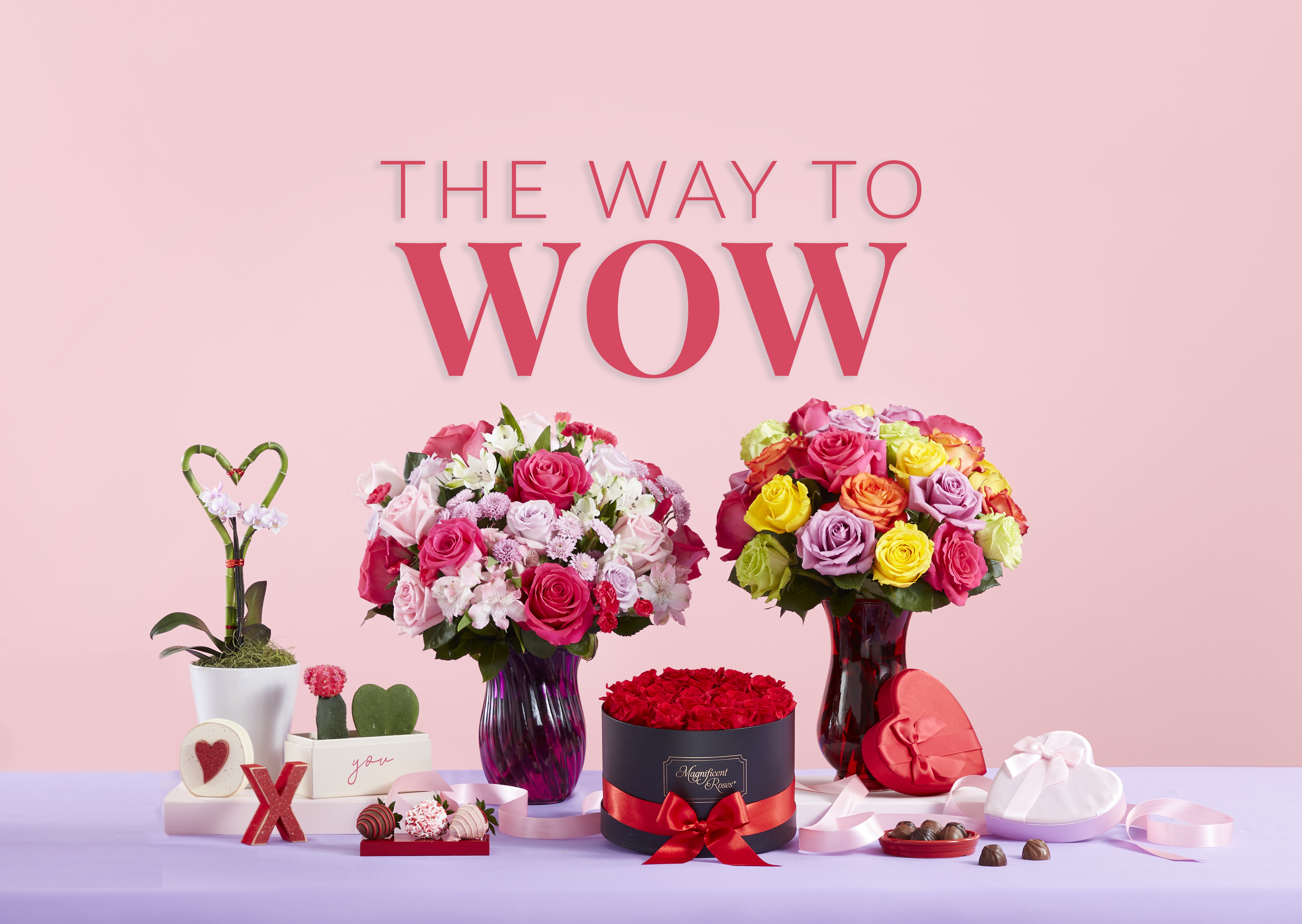 A display of bouquets, plants, chocolates, and chocolate covered strawberries, all part of the 1-800-Flowers.com The Way to Wow Valentine’s Day Collection