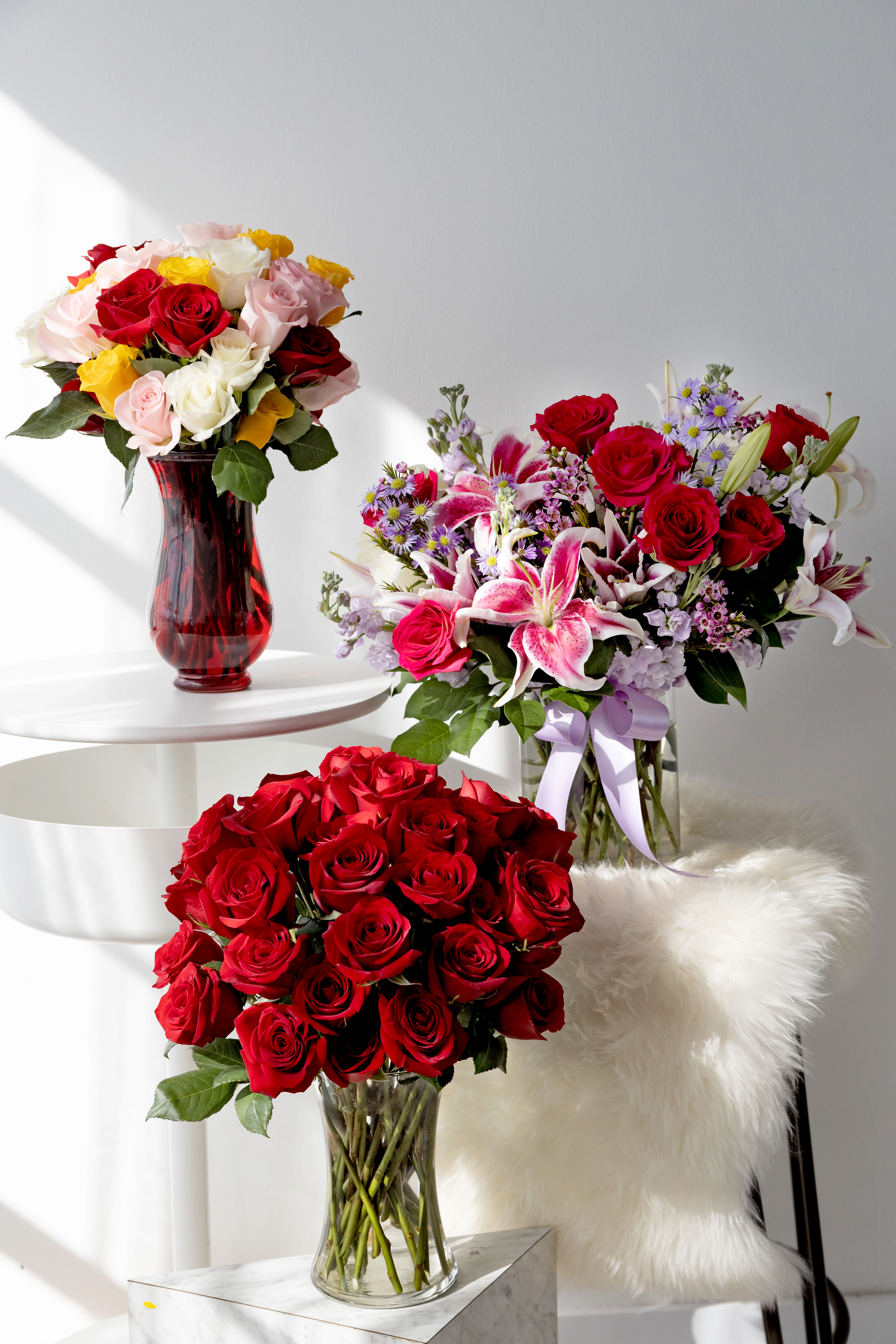 Three, large Valentine's Day bouquets of red, pink, purple, white, and yellow flowers