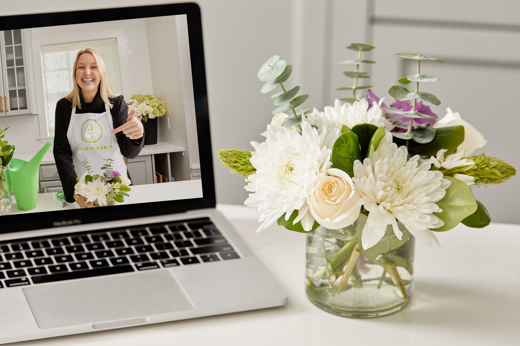 An Alice's Table expert instructing how to make a floral bouquet as part of a virtual workshop 