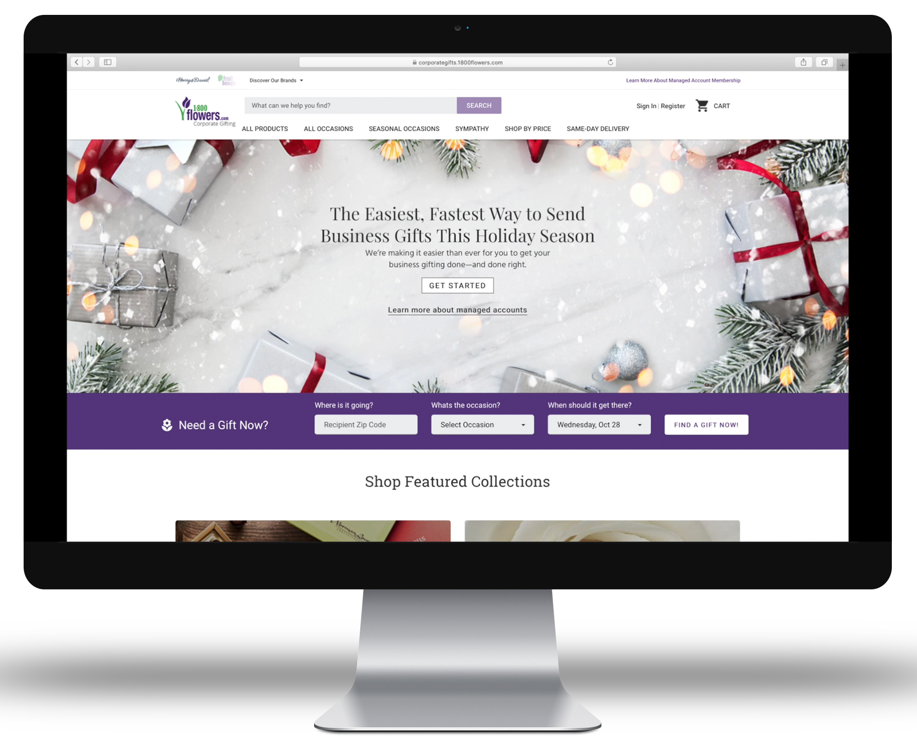 A computer with the homepage of the 1-800-flowers.com corporate gifting website on its screen