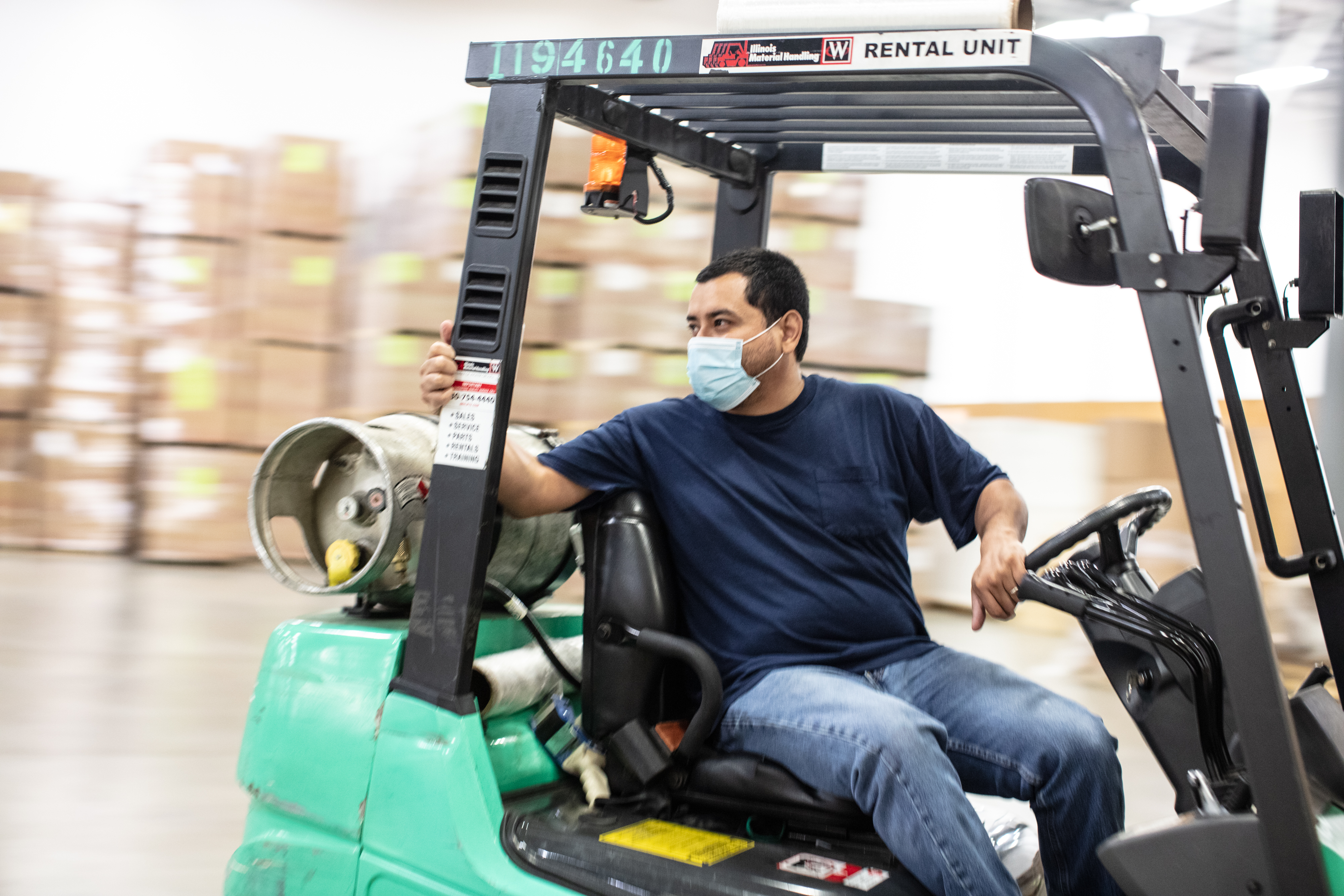 A man driving a forklift 