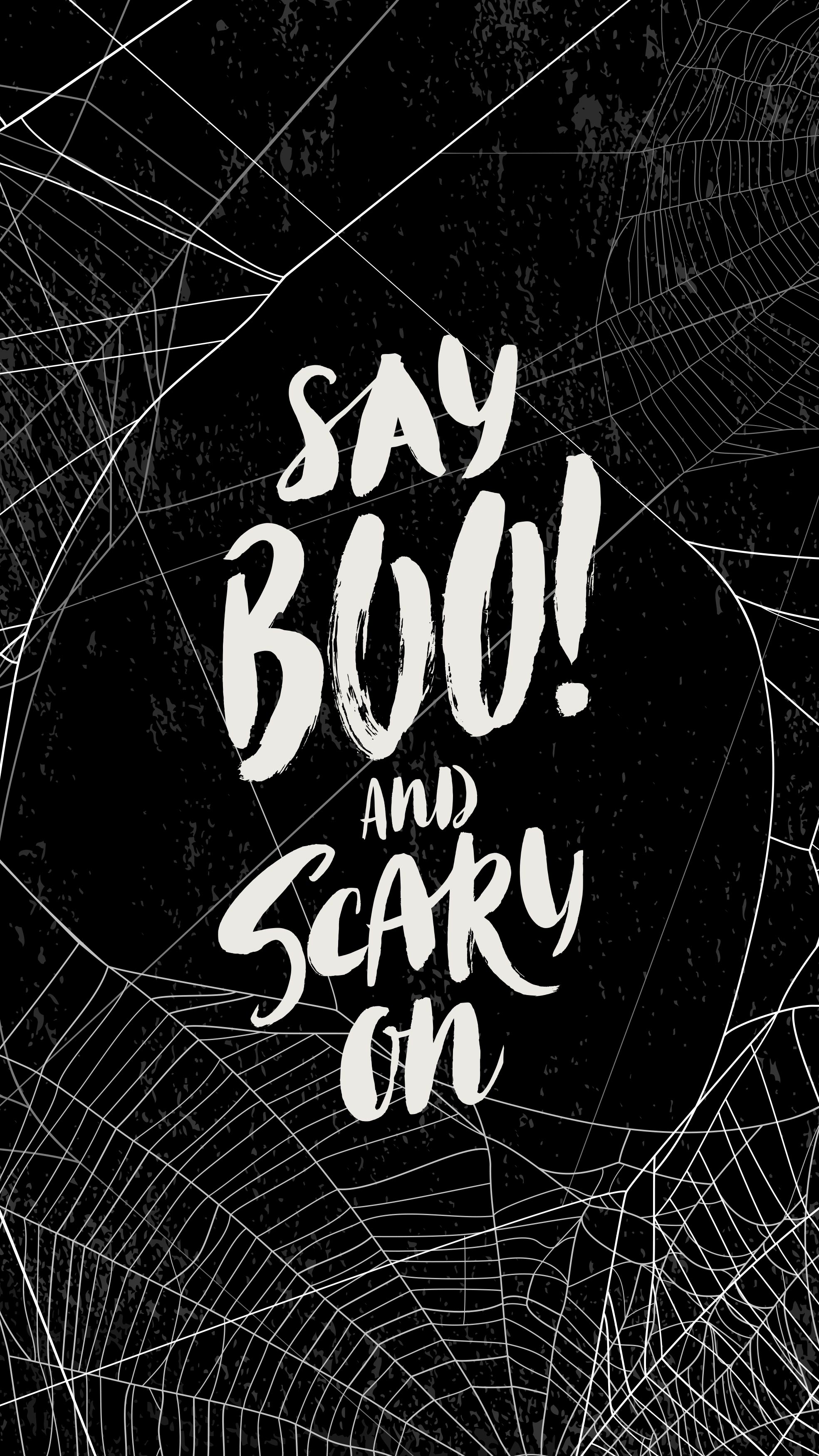 A black Halloween e-Card with spider webs that say "Say Boo and Scary On" 