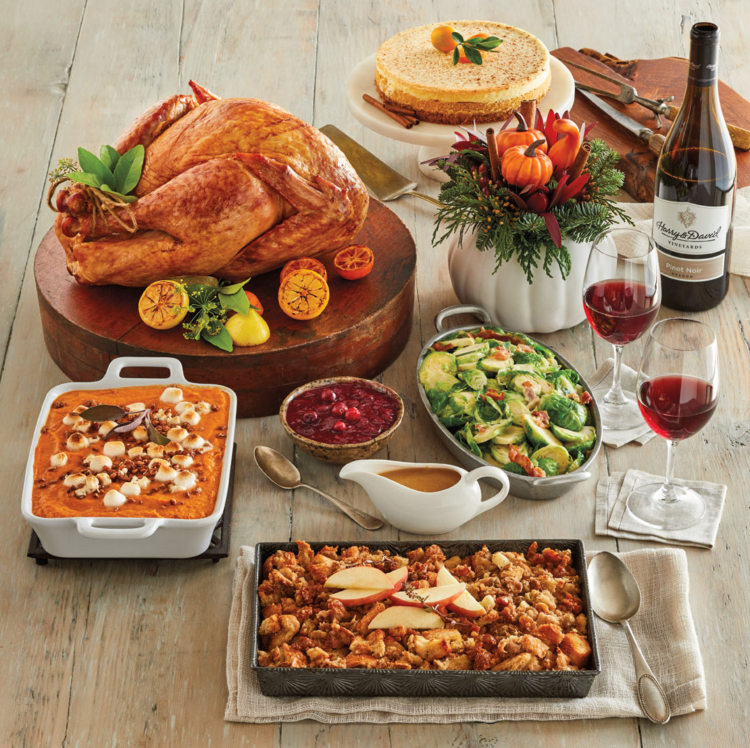 The Harry & David Gourmet Turkey Feast with an array of food and pinot noir