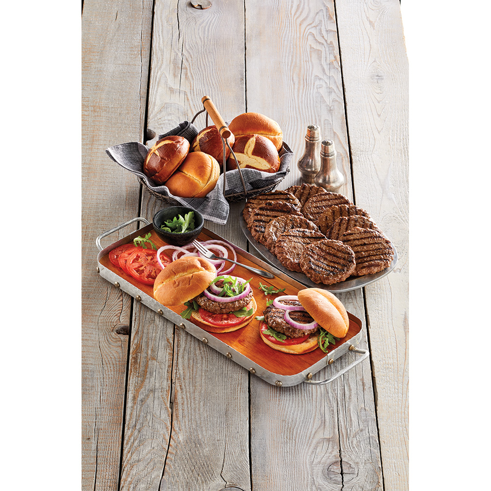 Burgers from Harry and David along with buns, lettuce, tomato, and onion 