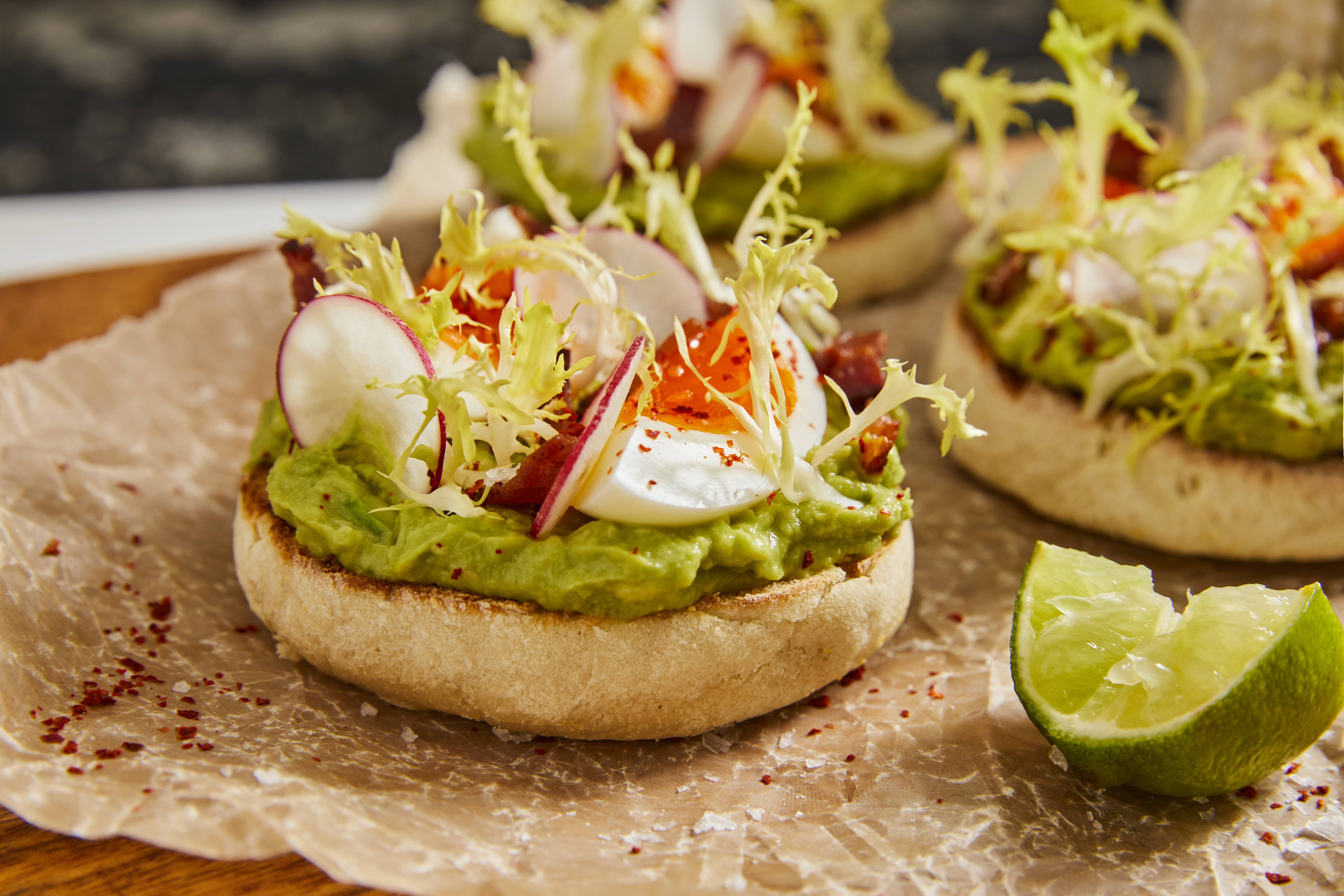 A spread of the Gwen Smashed Avocado Toast on a Wolferman's Bakery English Muffin