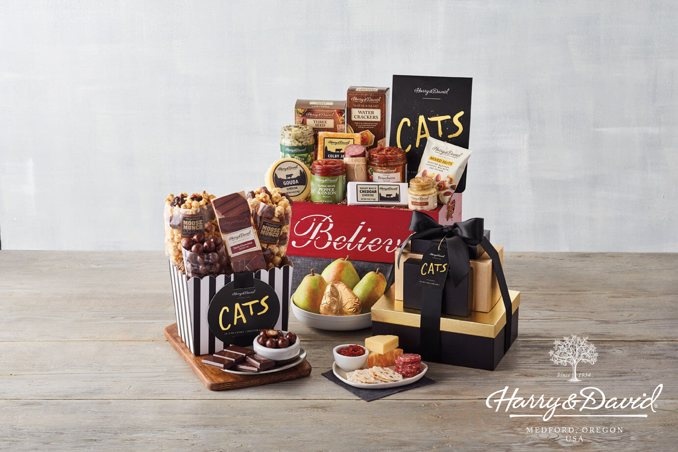 A display of gourmet items from the Harry & David Universal Pictures’ CATS Collection placed on a wooden table