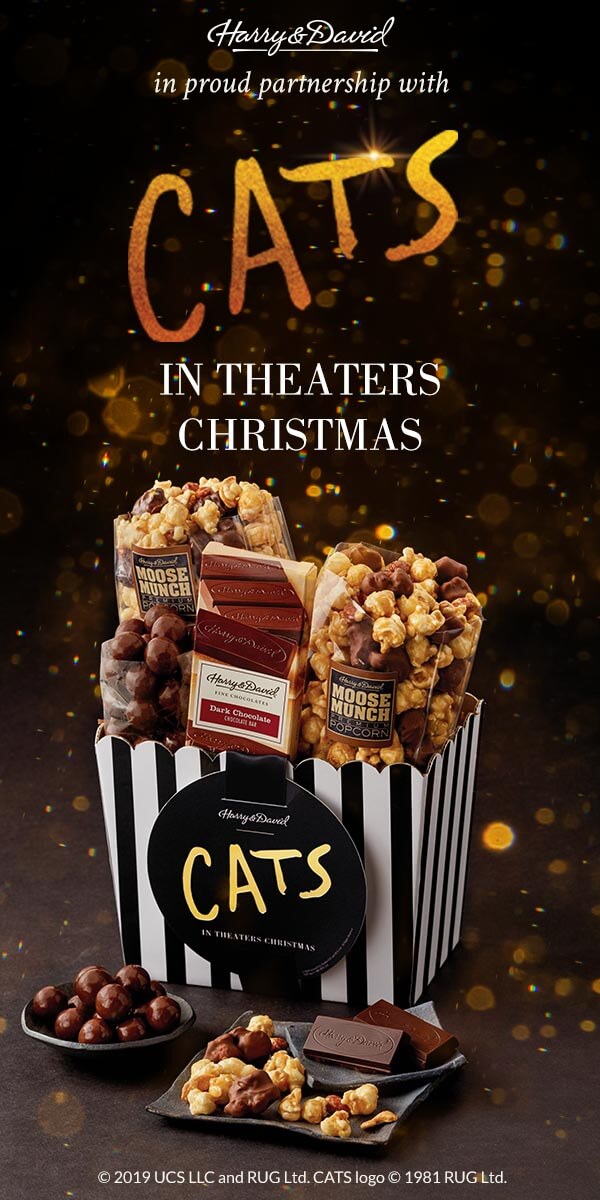 A display of gourmet items from the Harry & David Universal Pictures’ CATS Collection on a black and gold background