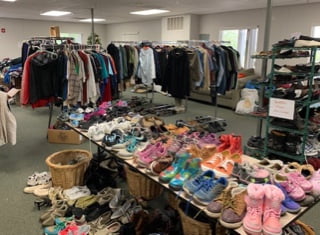 A room full of donated clothes and shoes at the Teresa McCormick Center in Medford, OR.